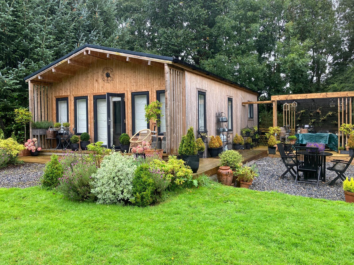 Timber garden room with glazed doors and decking, built and installed by Abwood