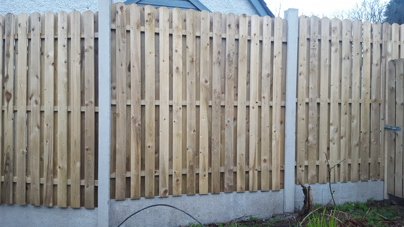 Hit and miss fencing with 4 inch round top boards by Abwood