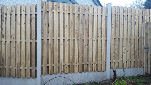 Hit and miss fencing with 4 inch round top boards by Abwood